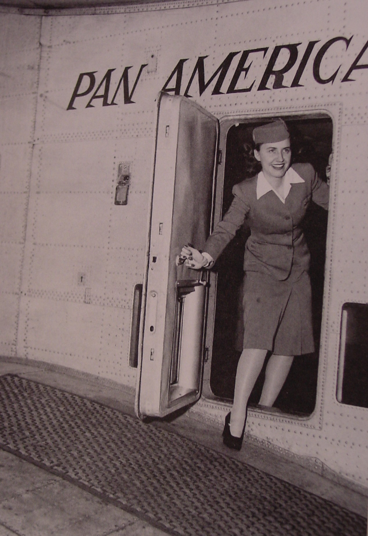 1940s Pan Am's first Stewardess, Madeline Cuniff in the doorway of a Boeing 314 flying boat